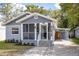 Charming single-Gathering home with a screened front porch, covered parking, and lovely landscaping at 524 W Winter Park St, Orlando, FL 32804