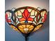 Unique stained glass wall sconce featuring a floral pattern with red, orange, and blue accents at 524 W Winter Park St, Orlando, FL 32804