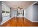 Bright living room with hardwood floors, large windows, and a ceiling fan at 524 W Winter Park St, Orlando, FL 32804