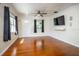 Inviting living room featuring hardwood floors, neutral walls, and modern ceiling fan at 524 W Winter Park St, Orlando, FL 32804