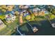 Aerial view showcasing the home's lakefront property, private dock, and verdant landscaping at 535 Spring Club Dr, Altamonte Springs, FL 32714