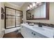 Bathroom features a glass enclosed shower, double sink vanity and decorative accent tiles at 535 Spring Club Dr, Altamonte Springs, FL 32714