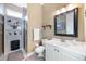 Well-lit bathroom showcasing a glass shower, white vanity, and ample storage space at 535 Spring Club Dr, Altamonte Springs, FL 32714