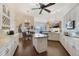 Open kitchen featuring white cabinetry, center island, stainless steel appliances, and beautiful views at 535 Spring Club Dr, Altamonte Springs, FL 32714