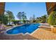 Backyard in-ground pool and jacuzzi overlooking the lake at 535 Spring Club Dr, Altamonte Springs, FL 32714