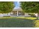 Wide view of a backyard and screened-in patio at 5571 Sycamore Canyon Dr, Kissimmee, FL 34758