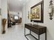 Inviting hallway featuring decorative accents, a console table, and an entryway into the living room at 5571 Sycamore Canyon Dr, Kissimmee, FL 34758