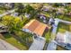 An aerial view of a single-Gathering home with a new roof, a large yard, and a long driveway at 6023 Sage Dr, Orlando, FL 32807