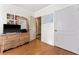 Bedroom featuring hardwood floors, a dresser and mirror at 6023 Sage Dr, Orlando, FL 32807