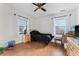 Comfortable bedroom featuring hardwood floors and natural light at 6023 Sage Dr, Orlando, FL 32807