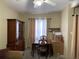 Dining area with a wooden table and chairs, cabinet, and window at 6023 Sage Dr, Orlando, FL 32807