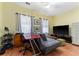 Cozy living room featuring hardwood floors and natural light at 6023 Sage Dr, Orlando, FL 32807