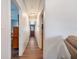 Hallway featuring wood floors, a red front door, and recessed lighting at 655 W Date St, Lake Wales, FL 33859