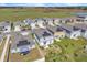 Aerial view of a neighborhood with new construction homes, some featuring solar panels at 659 Daring Dr, Davenport, FL 33837