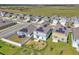 An aerial shot of a suburban neighborhood with solar panels and green lawns at 659 Daring Dr, Davenport, FL 33837