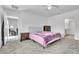 Bright bedroom features a queen bed and neutral walls and flooring at 659 Daring Dr, Davenport, FL 33837