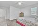 Light-filled bedroom features a pink bed frame and dresser, creating a serene retreat at 659 Daring Dr, Davenport, FL 33837