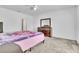 Light and airy bedroom with a queen size bed and dresser at 659 Daring Dr, Davenport, FL 33837