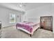 Bedroom with a queen bed, dresser and neutral walls and flooring at 659 Daring Dr, Davenport, FL 33837