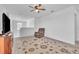 Cozy living room with a ceiling fan, plush rug, and comfortable recliner chair at 659 Daring Dr, Davenport, FL 33837