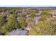 An elevated view shows the neighborhood's mature trees, well-maintained landscaping, and proximity to a nearby highway at 729 Strihal Loop, Oakland, FL 34787