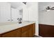 Bright bathroom featuring a sleek vanity with solid surface countertops and modern black faucet, inviting you to relax at 729 Strihal Loop, Oakland, FL 34787