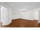 Bedroom featuring hard wood floors, a ceiling fan and two closets at 729 Strihal Loop, Oakland, FL 34787