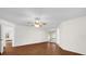 Bedroom featuring hardwood floors, a ceiling fan, and natural light at 729 Strihal Loop, Oakland, FL 34787