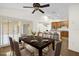 Staged dining room with views of the kitchen with hardwood floors at 729 Strihal Loop, Oakland, FL 34787