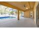 Enclosed patio with a ceiling fan overlooking the swimming pool at 729 Strihal Loop, Oakland, FL 34787