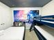 Fun bedroom with a twin bed, bunk beds, and Star Wars themed decor and a ceiling painted to resemble outer space at 7717 Graben St, Kissimmee, FL 34747