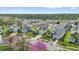 An elevated view of the homes in the neighborhood showcase the well maintained landscaping at 8136 Fan Palm Way, Kissimmee, FL 34747