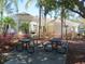 Community picnic area offers shady tables and lovely landscaping for relaxing gatherings at 8136 Fan Palm Way, Kissimmee, FL 34747