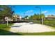 Enjoy a match on the community's sand volleyball court, surrounded by lush greenery and open skies at 8136 Fan Palm Way, Kissimmee, FL 34747