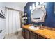 Cozy bathroom featuring a unique vanity and a shower with a white shower curtain at 8534 Black Mesa Dr, Orlando, FL 32829