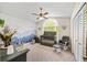 Charming Bedroom with gray furniture, mural, and natural light from the arched window at 8534 Black Mesa Dr, Orlando, FL 32829