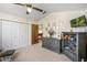 Bright Bedroom featuring ample closet space, gray furniture, and neutral tones at 8534 Black Mesa Dr, Orlando, FL 32829