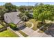 Elevated view of the home on a corner lot with a spacious, manicured lawn at 8534 Black Mesa Dr, Orlando, FL 32829