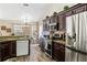 Stylish kitchen featuring stainless steel appliances, granite countertops and bar stool seating at 8534 Black Mesa Dr, Orlando, FL 32829