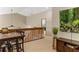 View of the landing with tan carpet, wooden banister, and view to the lower level at 8534 Black Mesa Dr, Orlando, FL 32829