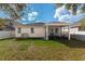 Exterior view of home's backyard and screened in porch, ideal for outdoor living and entertaining at 8813 Tatara, Orlando, FL 32836