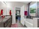 Bright bathroom with a bathtub, shower, and a view into the bedroom at 8813 Tatara, Orlando, FL 32836