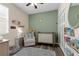 Cozy Bedroom featuring a neutral color scheme, comfortable armchair, and charming Winnie the Pooh accents at 8813 Tatara, Orlando, FL 32836