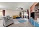 Spacious living room featuring modern furniture, tiled floors, and a sliding glass door at 8813 Tatara, Orlando, FL 32836