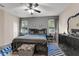 Spacious main bedroom featuring a ceiling fan, wood floors and neutral colors at 8813 Tatara, Orlando, FL 32836