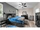 Main bedroom with modern ceiling fan, wood floors and neutral colors at 8813 Tatara, Orlando, FL 32836