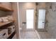 Bathroom featuring a marble shower surround and built in storage at 8929 Charleston Park # 12, Orlando, FL 32819