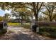 Gated entrance to Bay Hill Village, providing security and exclusivity for residents at 8929 Charleston Park # 12, Orlando, FL 32819