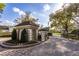 Elegant guard house at the entrance to Bay Hill Village, ensuring privacy and security for residents at 8929 Charleston Park # 12, Orlando, FL 32819