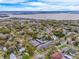 An aerial view showing the neighborhood and surrounding lake at 936 N Baker St, Mount Dora, FL 32757